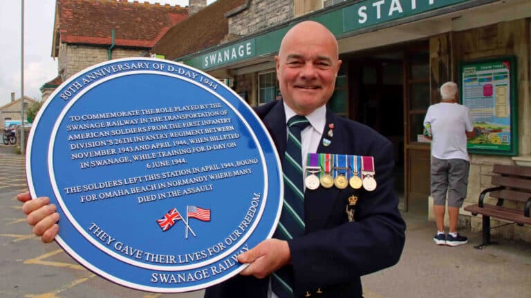 srt chairman frank roberts with d day 80 plaque swanage station
